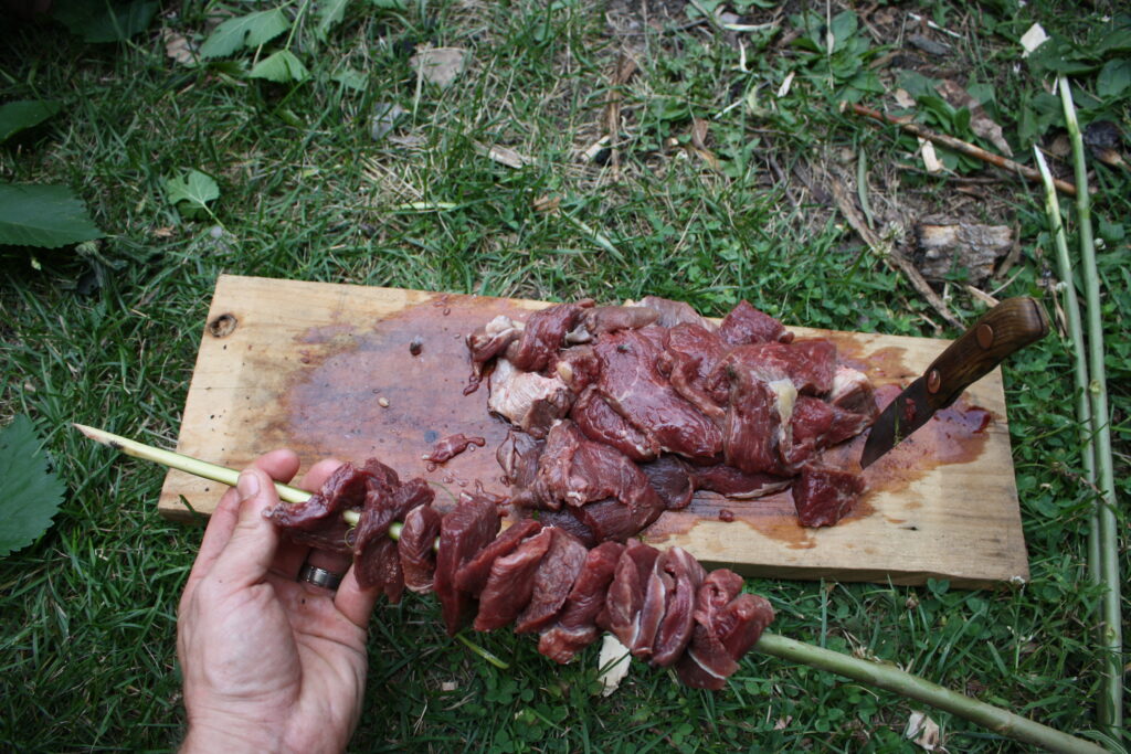 meat being put on a skewer