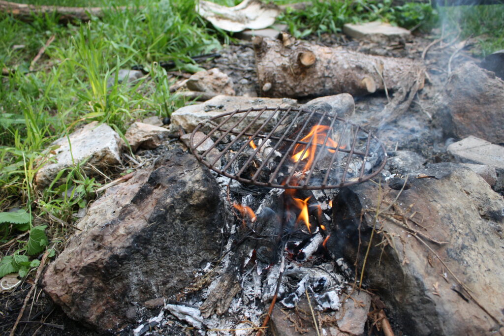 grill iron on a campfire