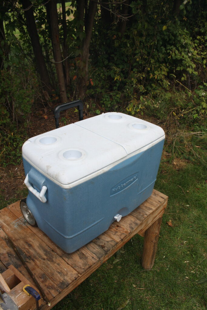 cooler sitting on a wooden table