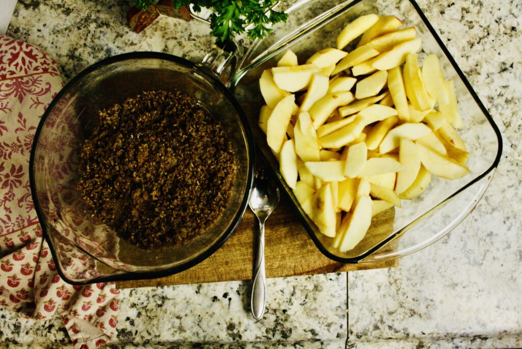 pan of sliced apples and bowl of crisp toppings