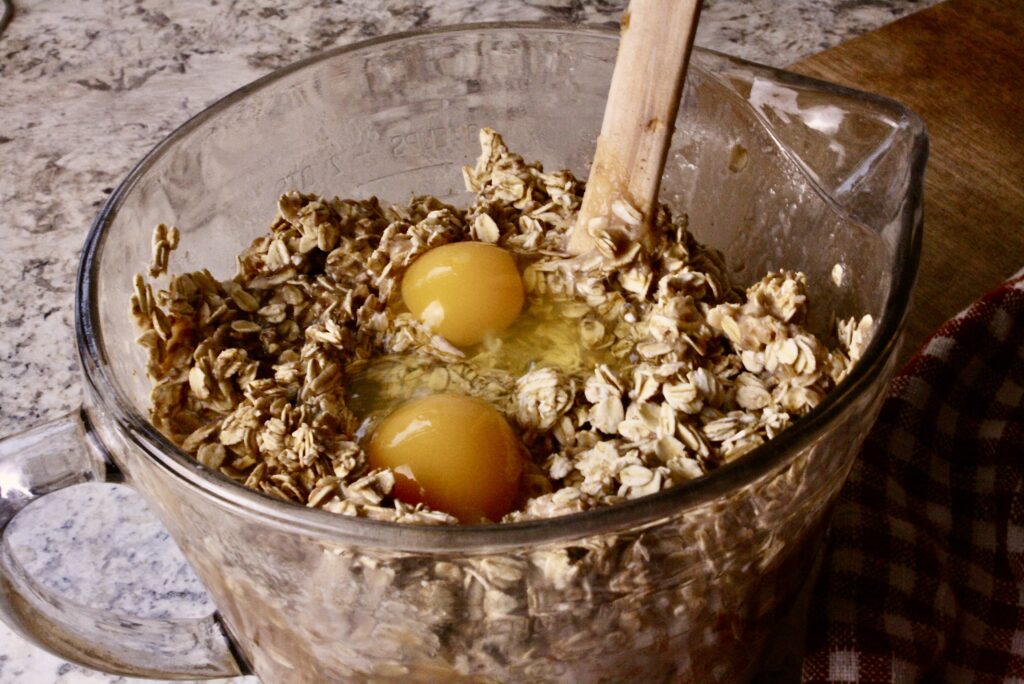 Mixing bowl with ingredients with two eggs