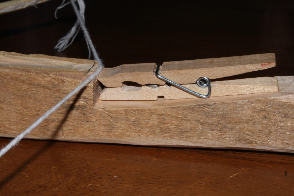 close-up of a loaded crossbow with the string resting on the trigger mechanism