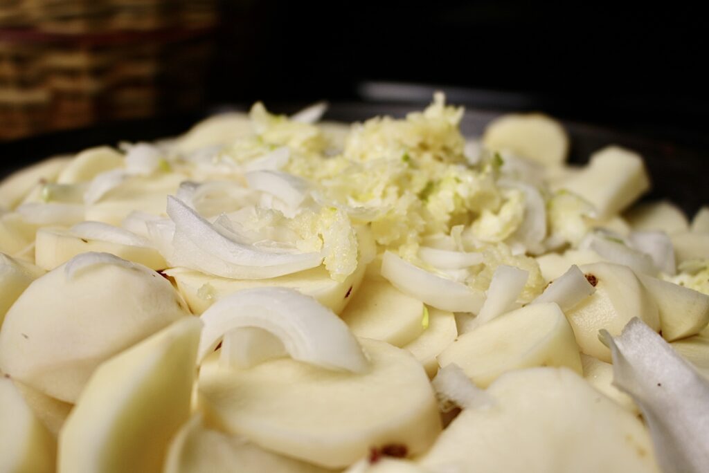 sliced potatoes with onions and garlic