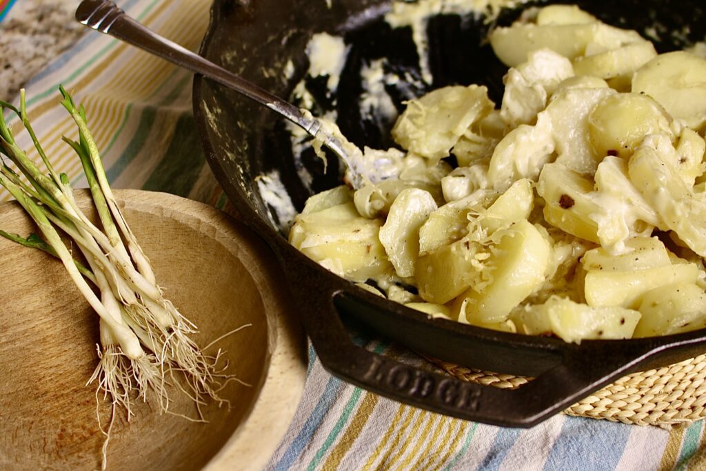 skillet with creamy potatoes