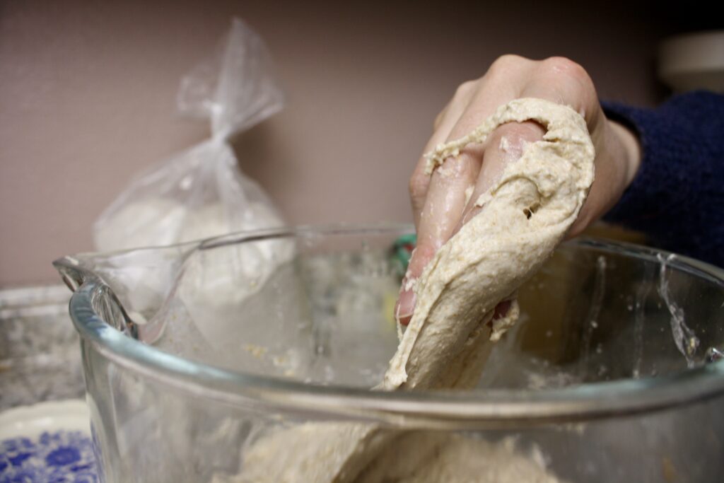 hand folding sourdough dough