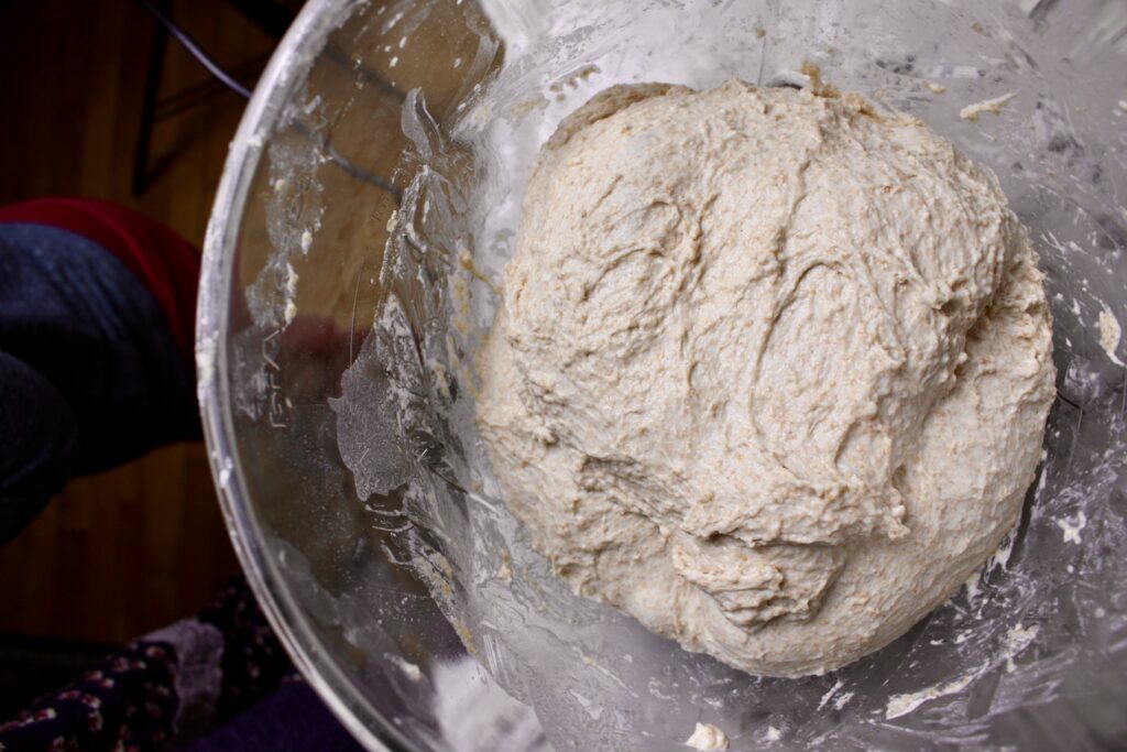 bread dough in a clear bowl