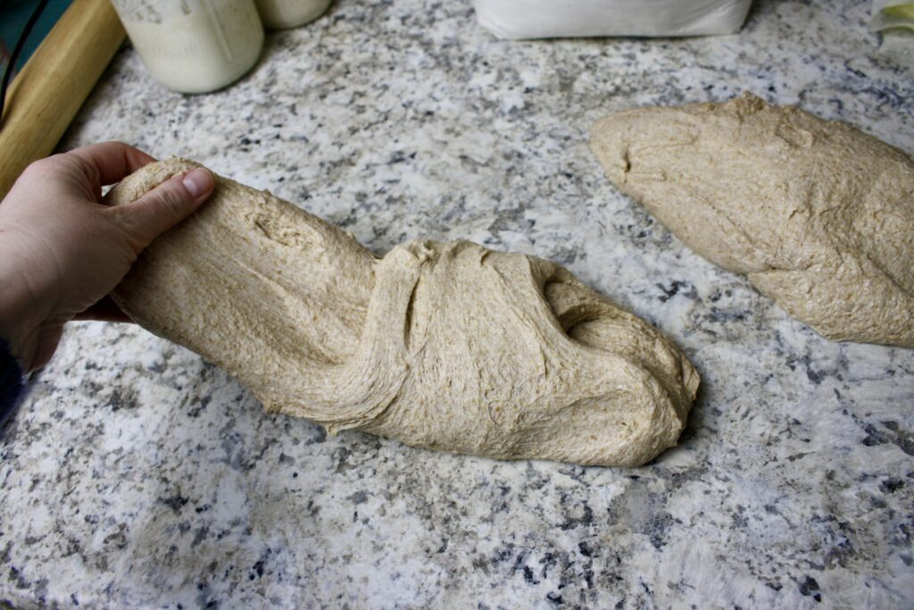 hand folding sourdough