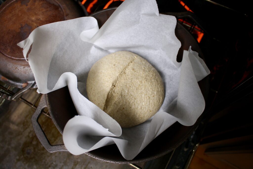 unbaked sourdough loaf in dutch oven