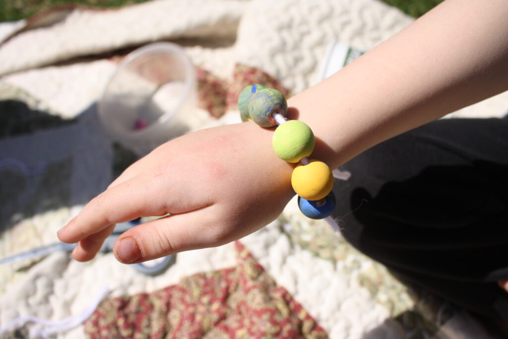 wooden bead bracelet on a wrist