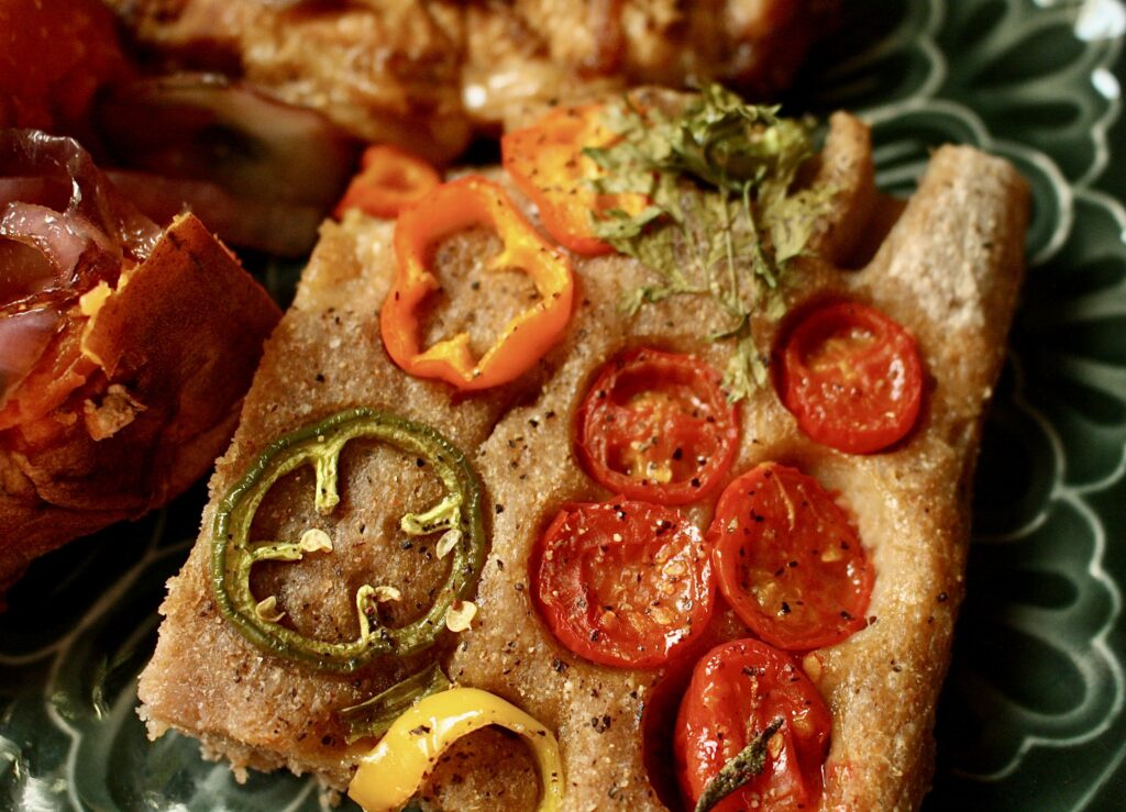 cut piece of focaccia on a plate 