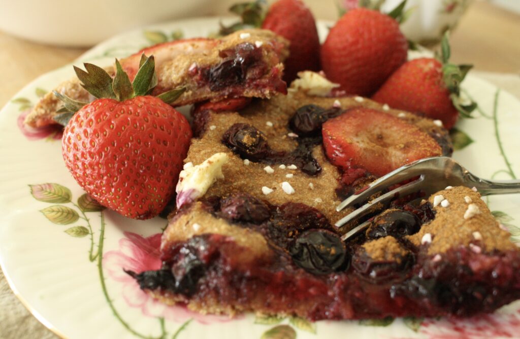 berry sourdough focaccia with strawberries on a plate