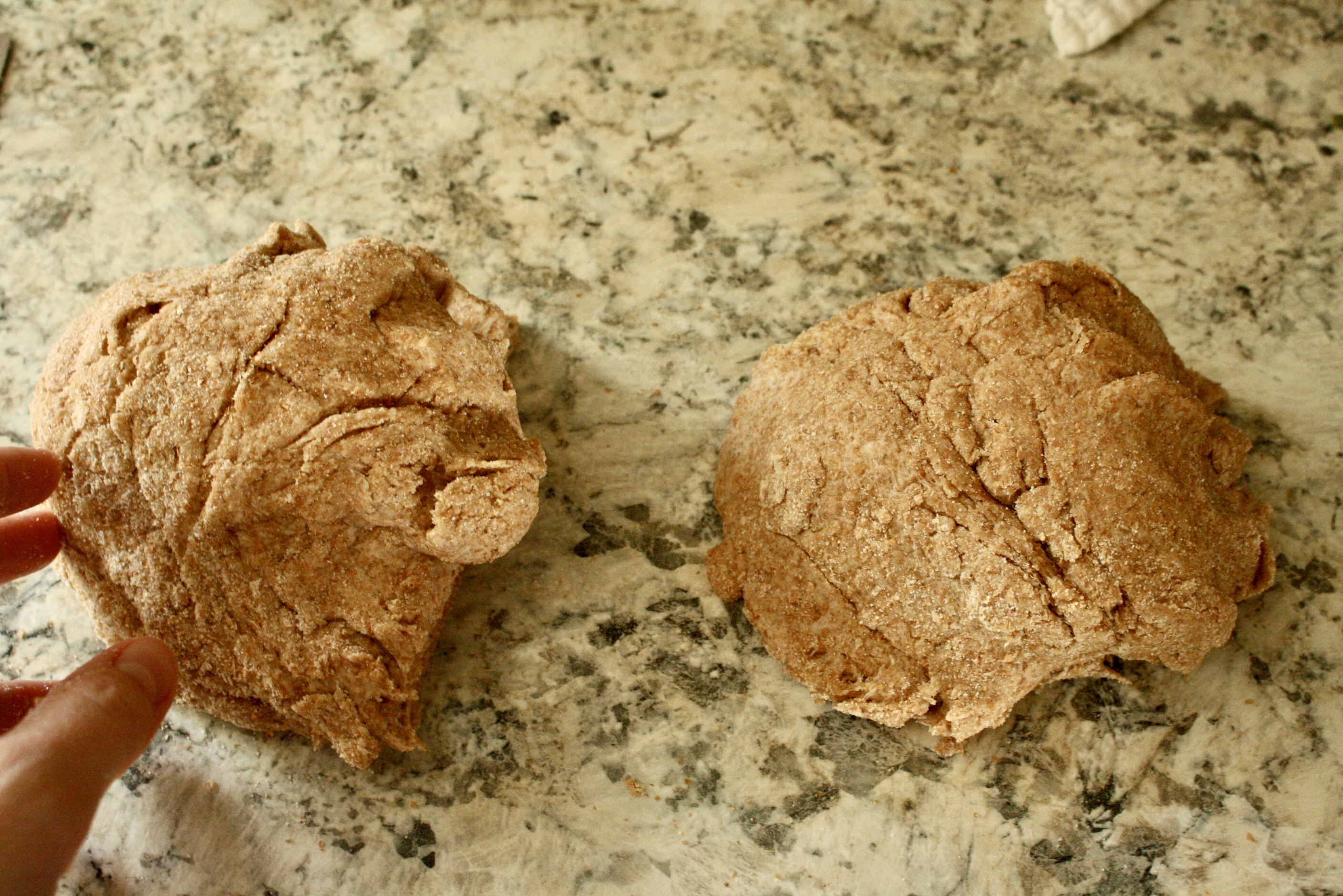 two balls of dough sitting on counter