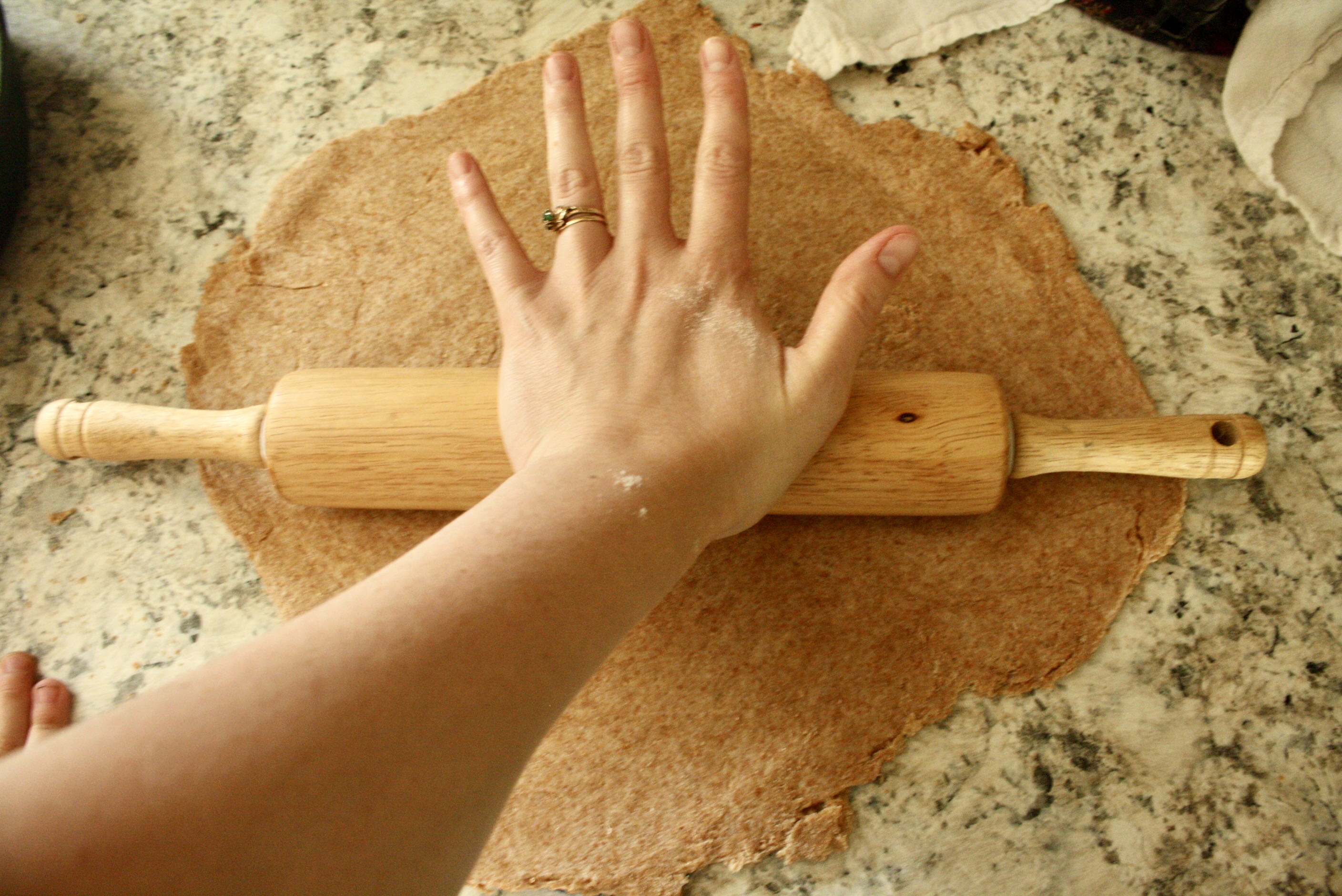 hand rolling out easy crust