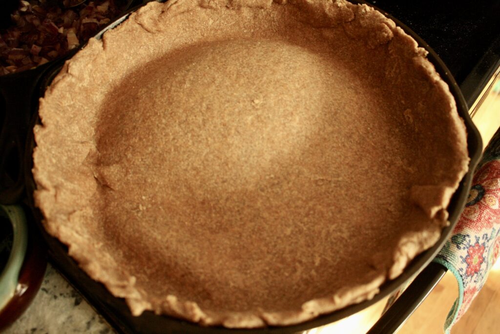 baked crust in a cast iron skillet