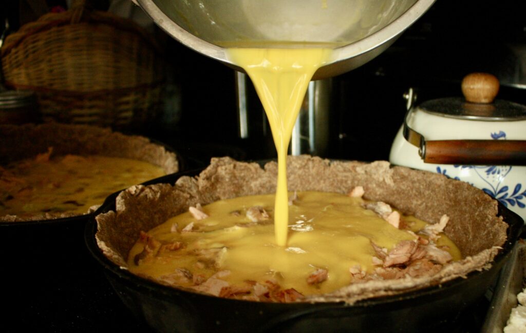 quick and easy crust being filled with eggs and salmon