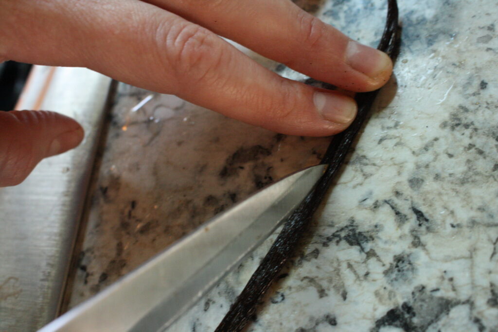 knife slicing a vanilla bean