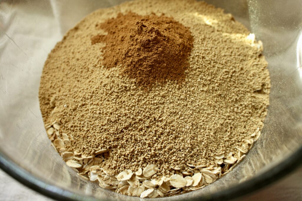 oats, scant, and cinnamon in a glass bowl