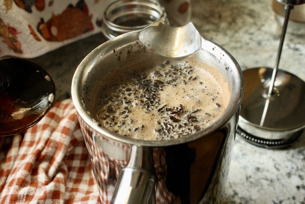 coffee ground floating on water in a French press