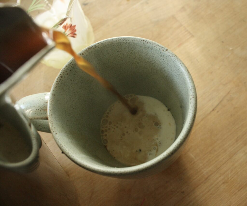 coffee being poured into a cup