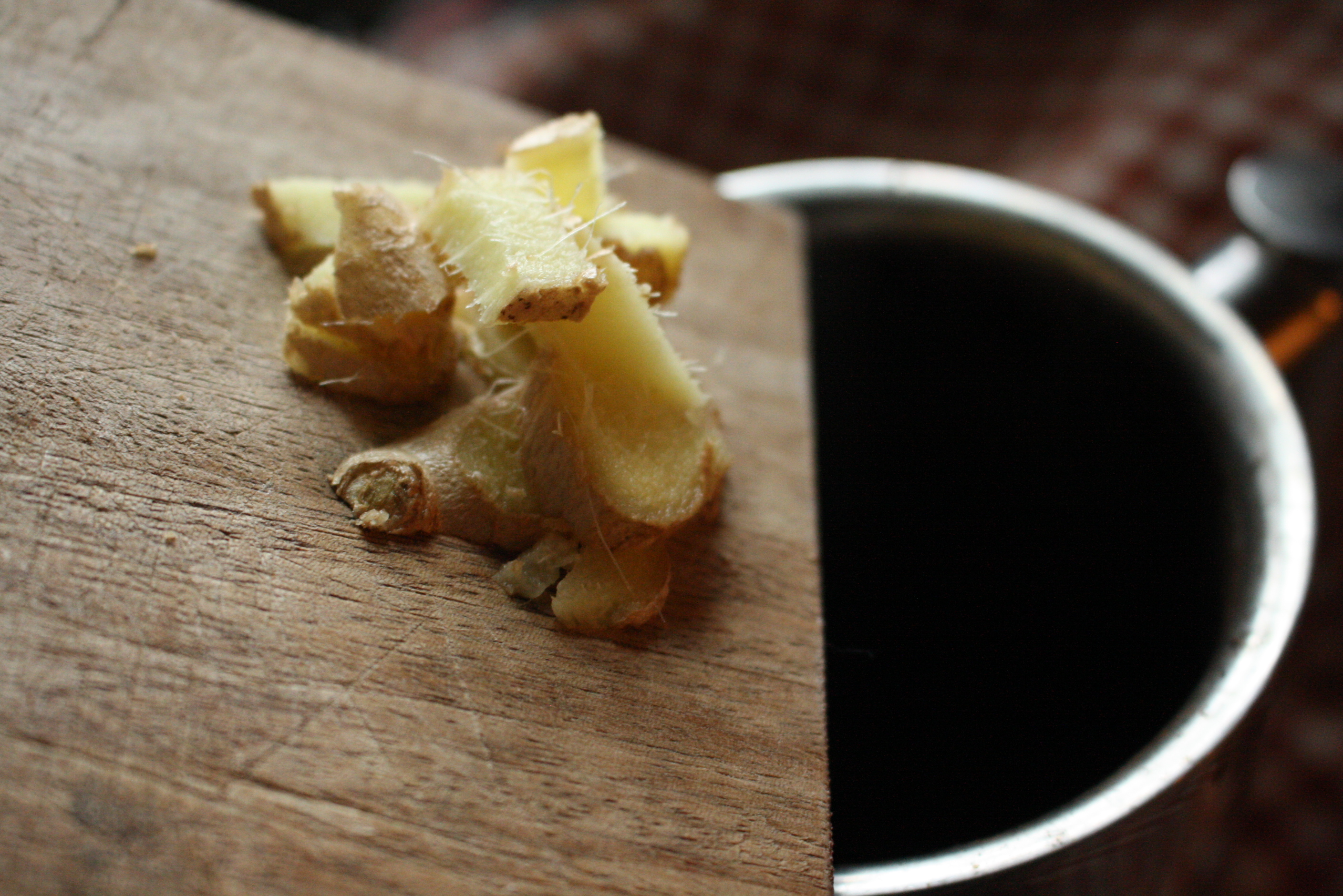 ginger being poured into a French press