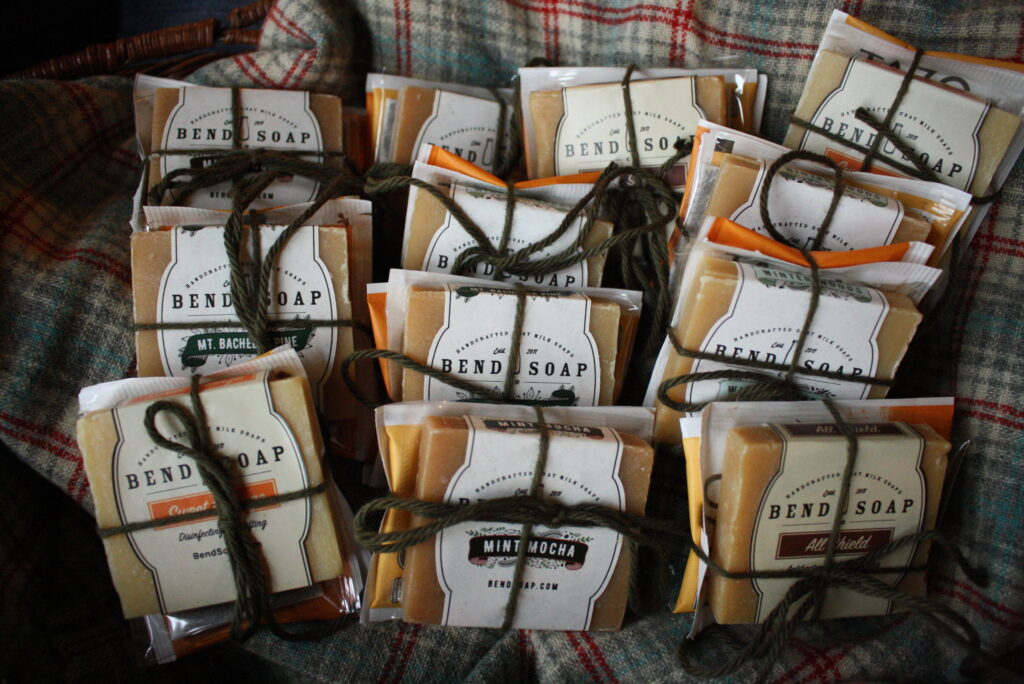 little packages of soap and tea bags tied up in a basket