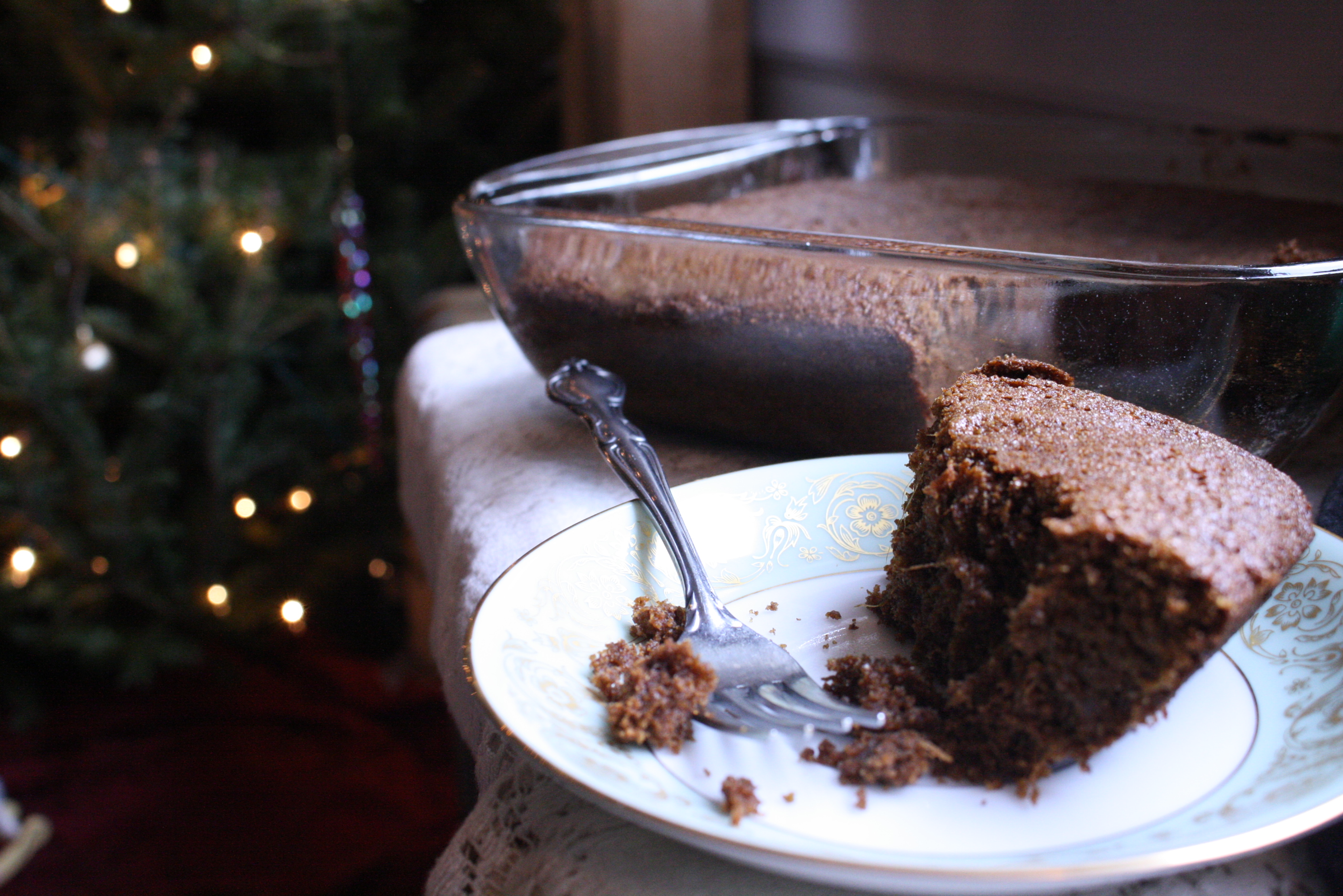 piece of gingerbread cake and fork on a plate