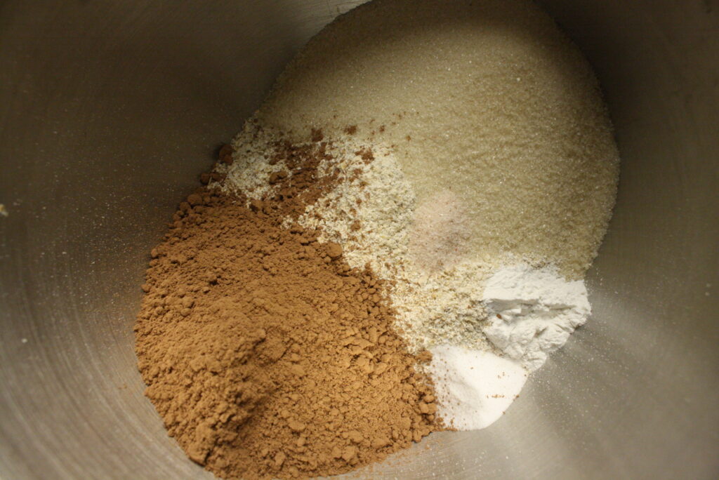 oat flour, sugar, cocoa powder, baking soda, baking powder, and salt in a mixing bowl