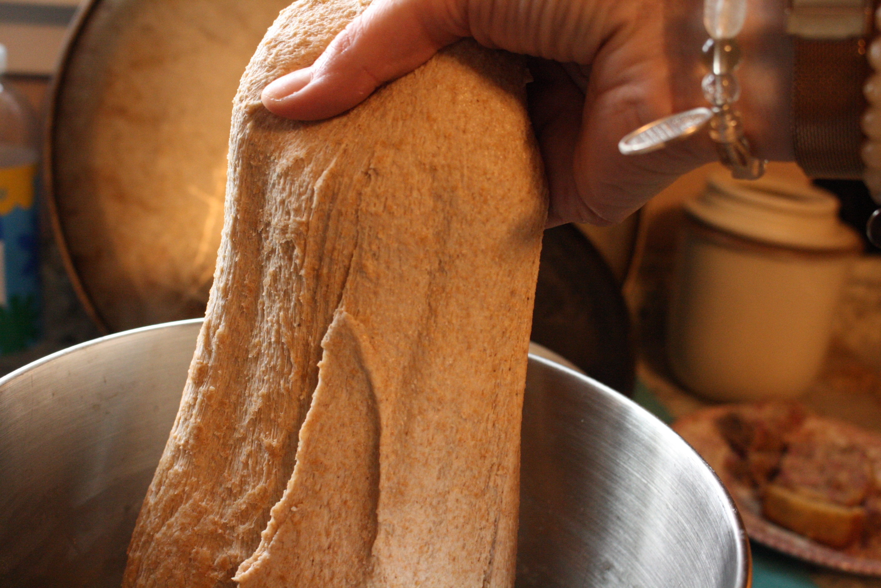 hand stretching dough