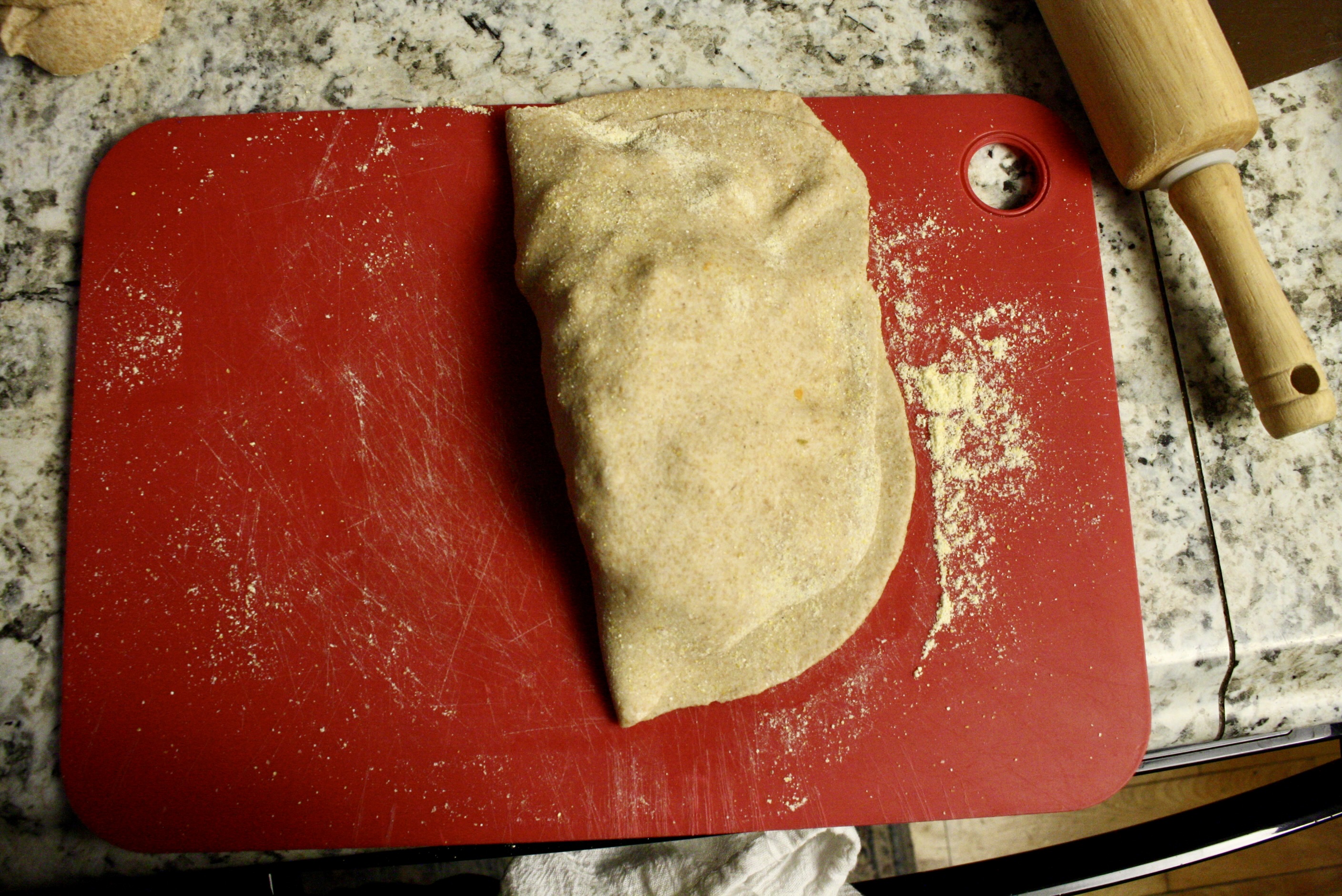 dough folded over on a cutting board