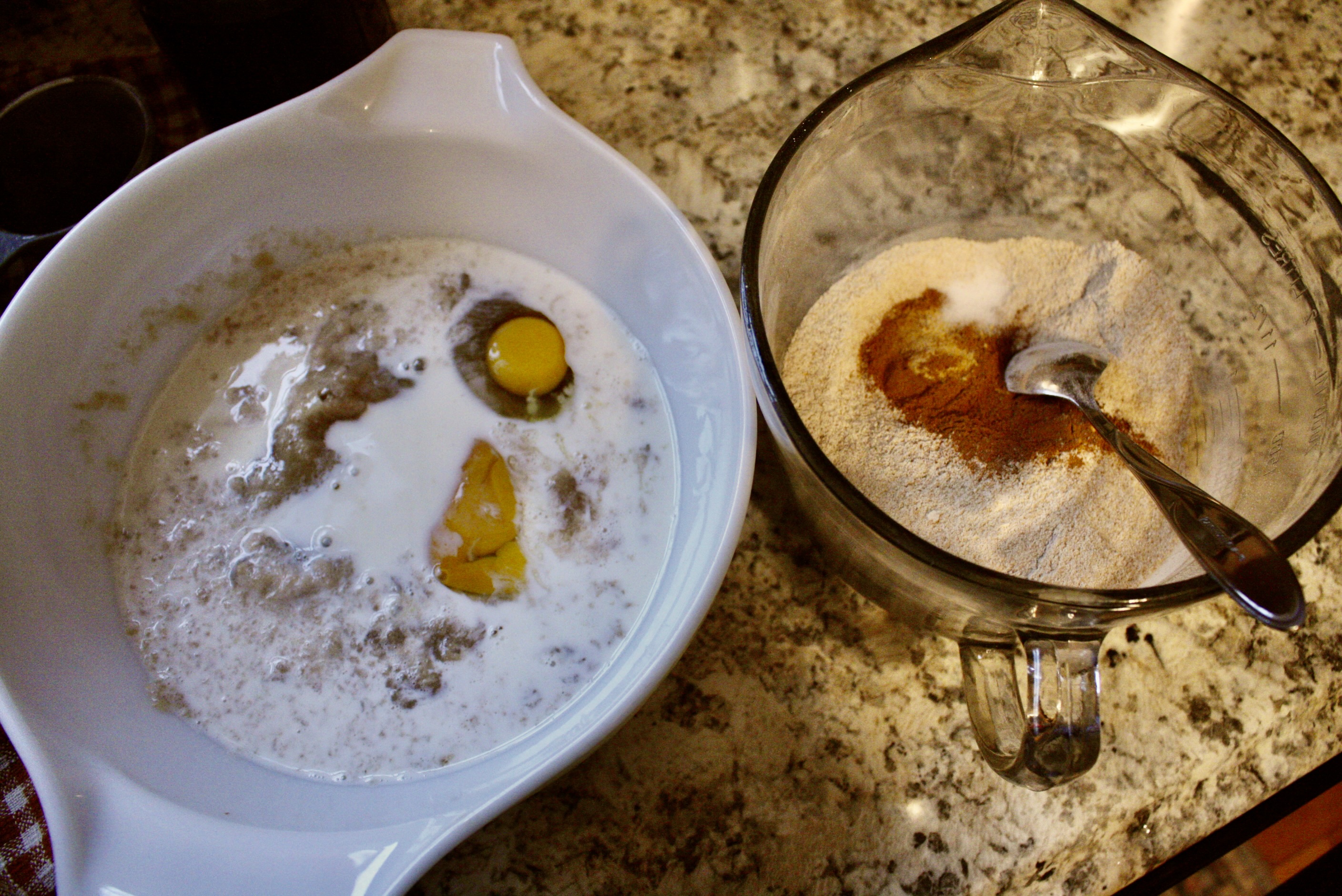 two bowls of muffin ingredients sitting on a countertop