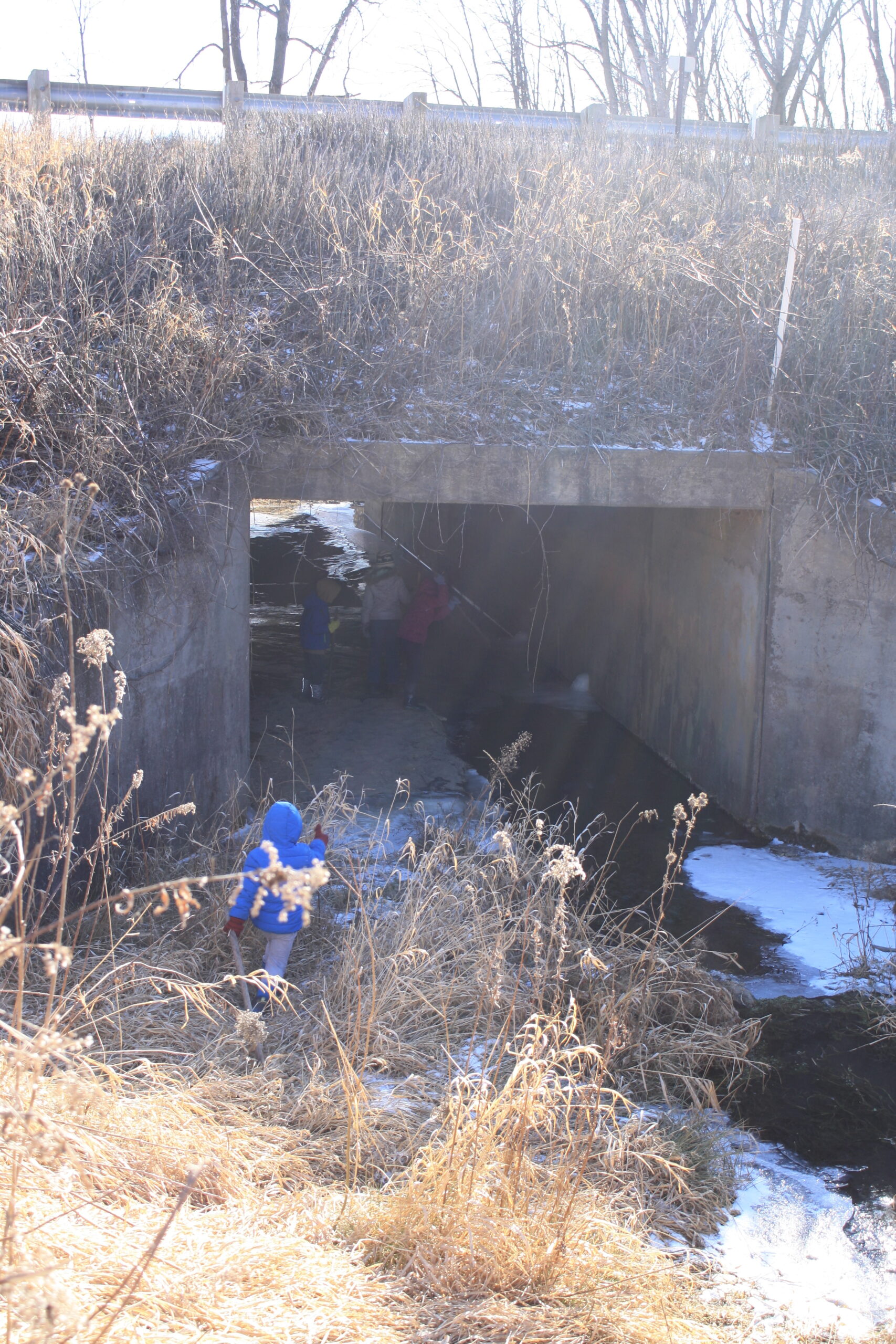 a tunnel with a icy creek flowing through it