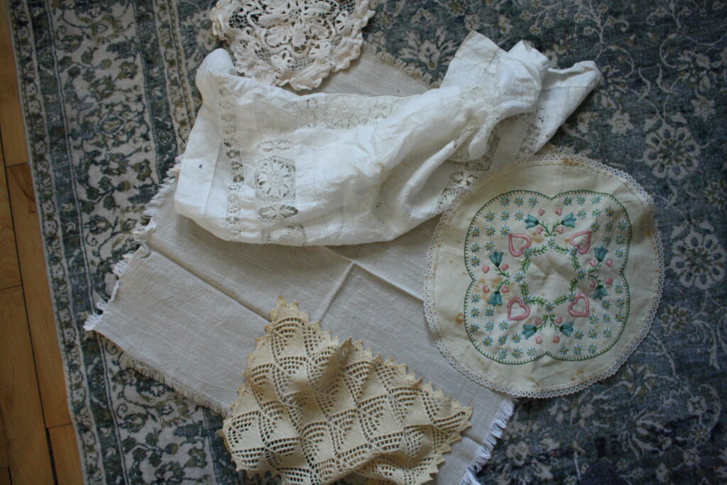 lace doilies in a pile on the floor