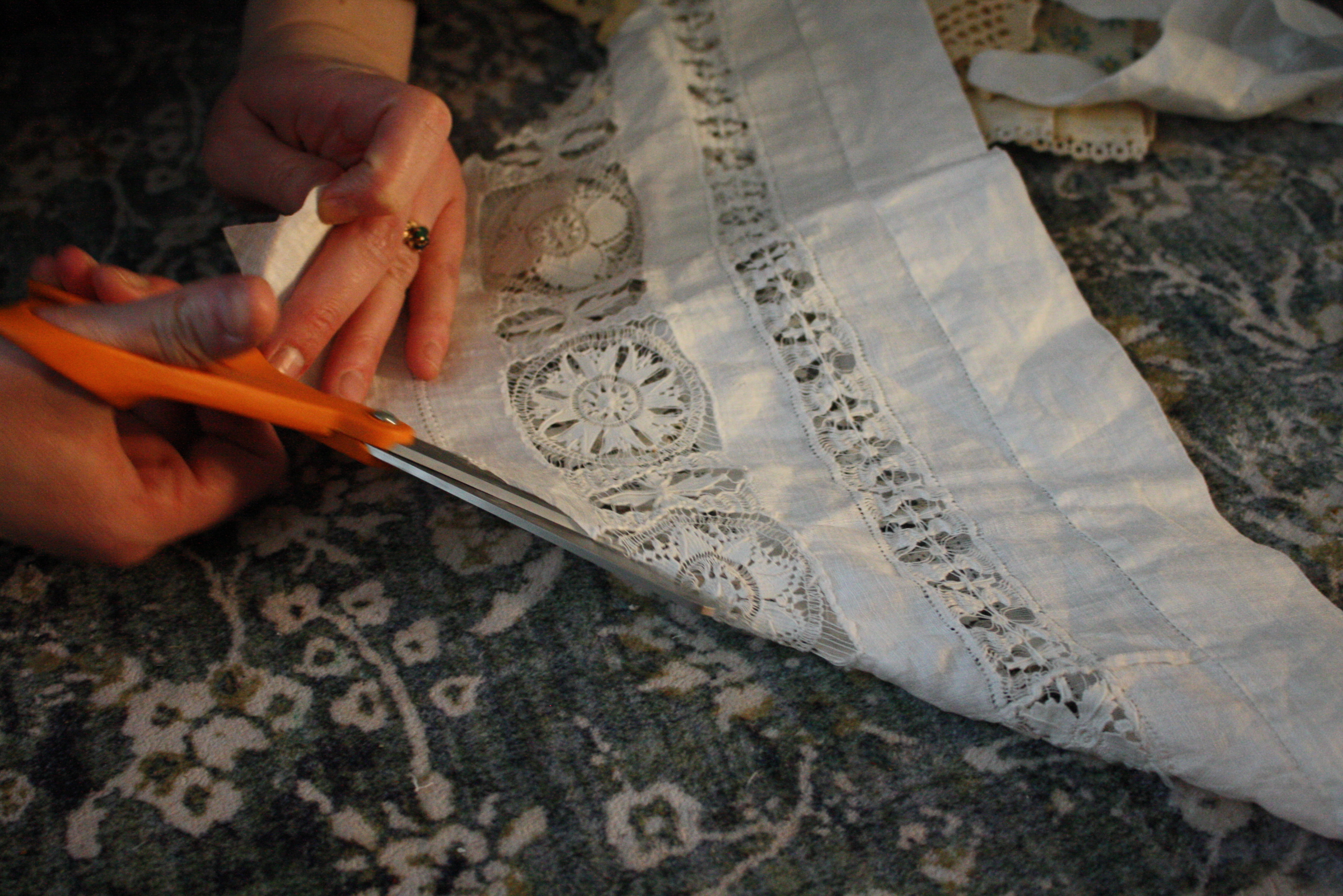 hand cutting doily in half