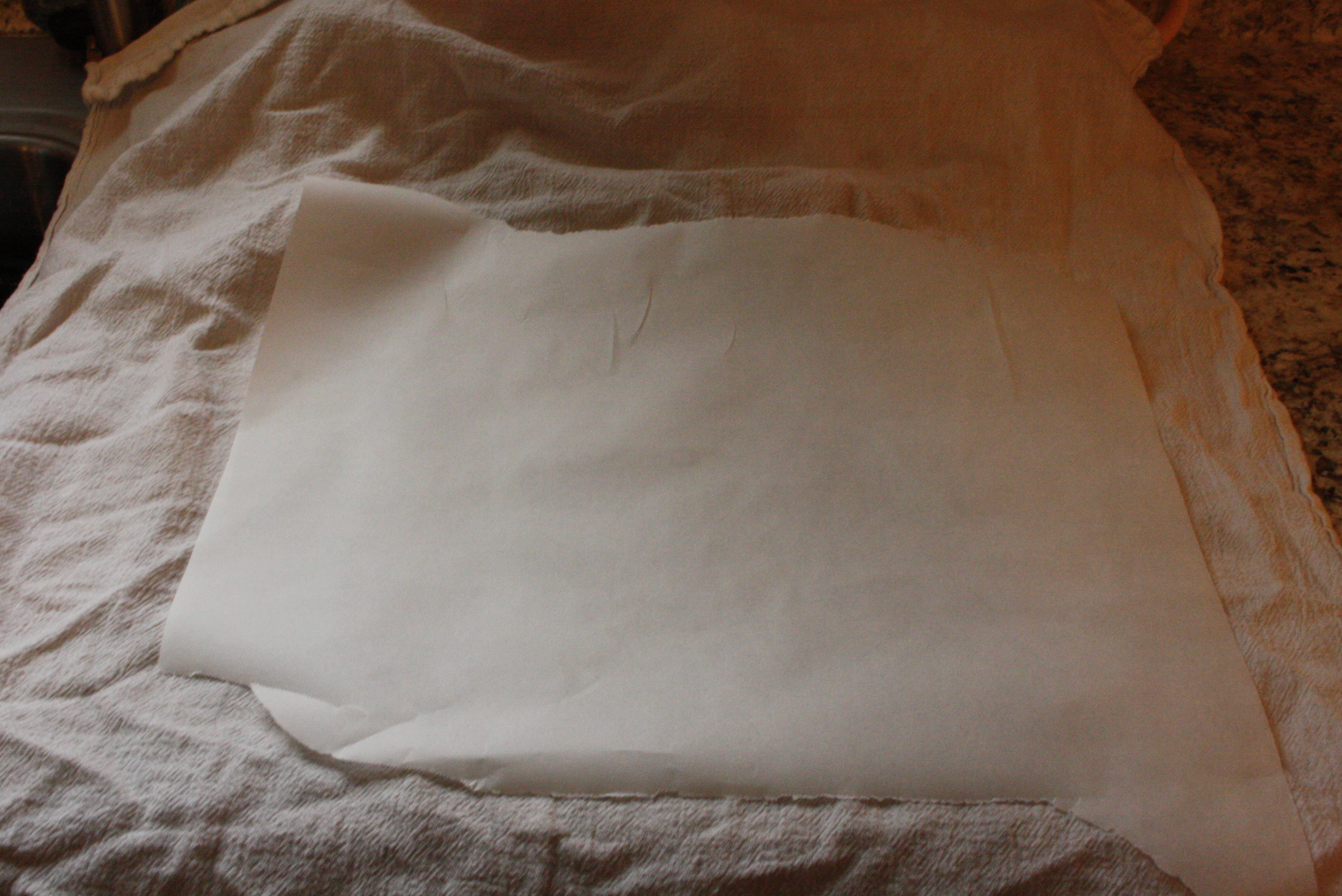 parchment paper on a towel on a counter