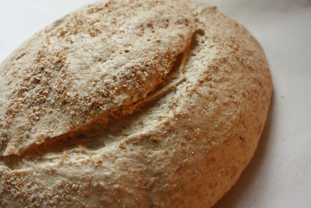 freshly scored dough on parchment paper