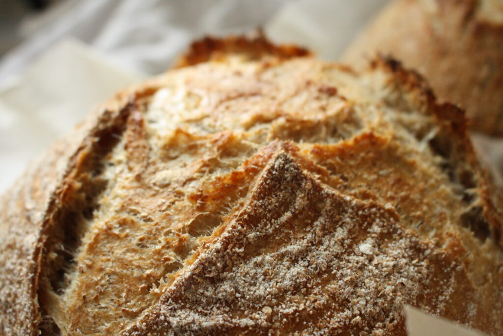 Up close photo of a round whole wheat sourdough loaf